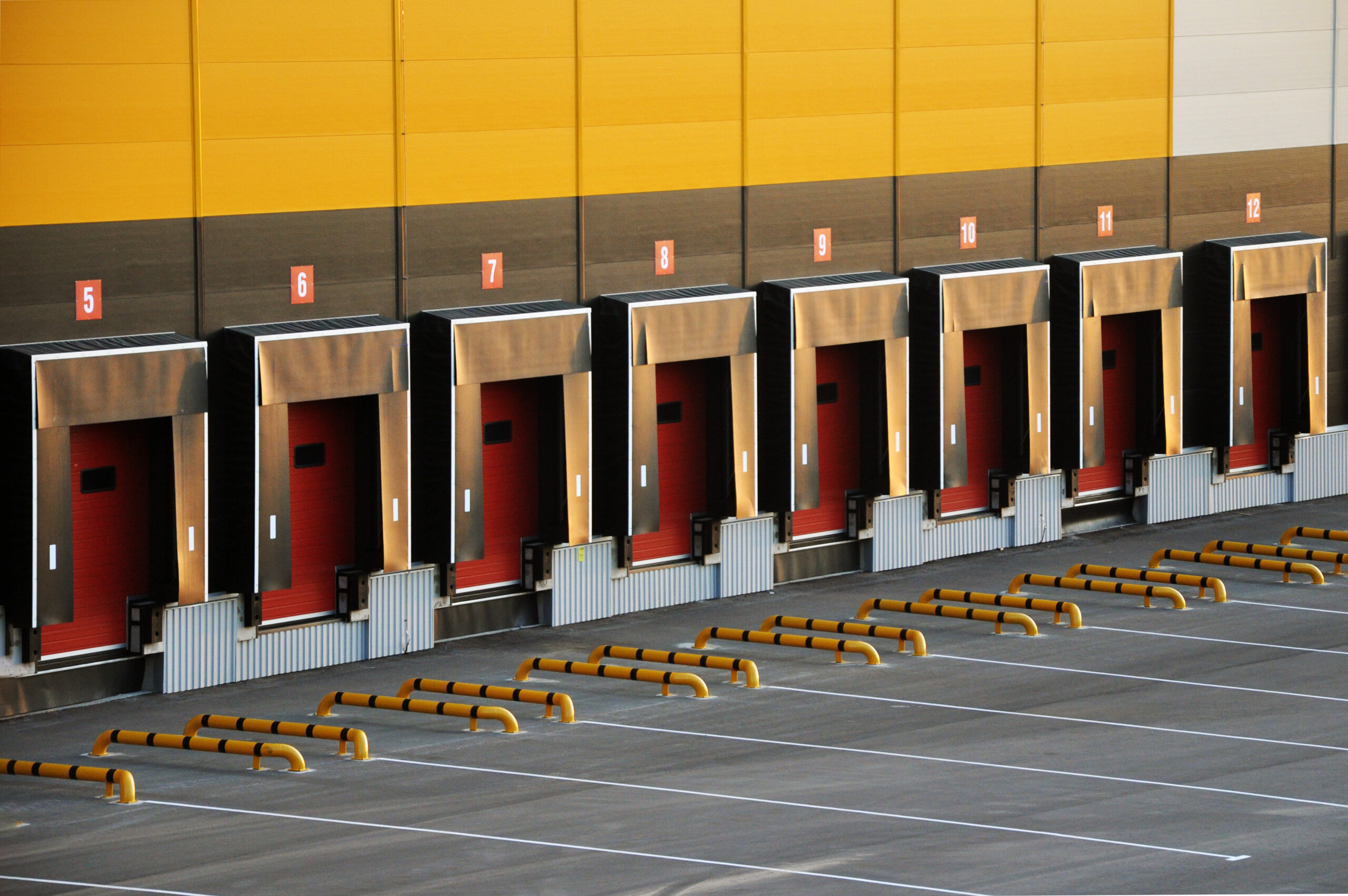 Eight commercial loading dock bays with loading dock levelers, dock shelters and dock seals installed