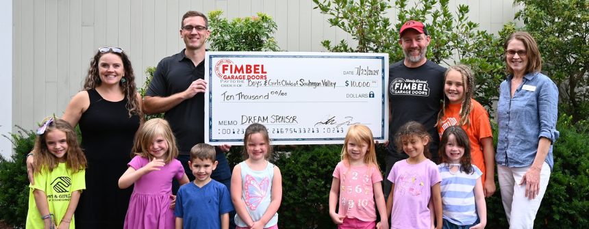 Fimbel Garage Doors team with donation check to local nonprofit organization located in Merrimack, NH